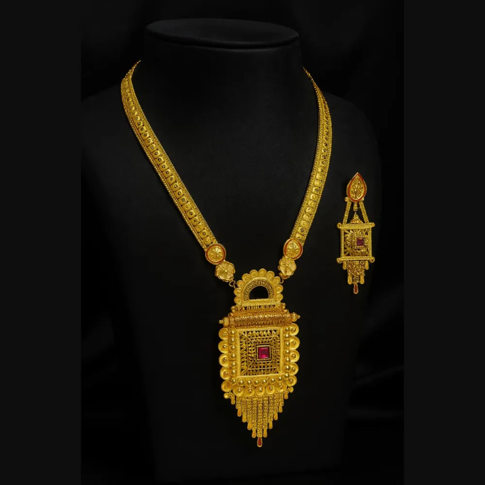 Two milligram gold plated Ranihaar long necklace set with ruby pendant and matching earrings on black dummy, traditional temple jewellery handcrafted.