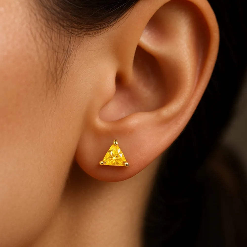 Women’s yellow crystal triangle stud earrings with real gold plating, handcrafted on a copper and brass base. These pushback earrings feature a bright yellow gemstone that gives a rich, elegant glow. Perfect for daily wear, gifting, or special occasions. Lightweight, beautiful, and timeless – from ZHome, Real, Good-Looking Jewellery.