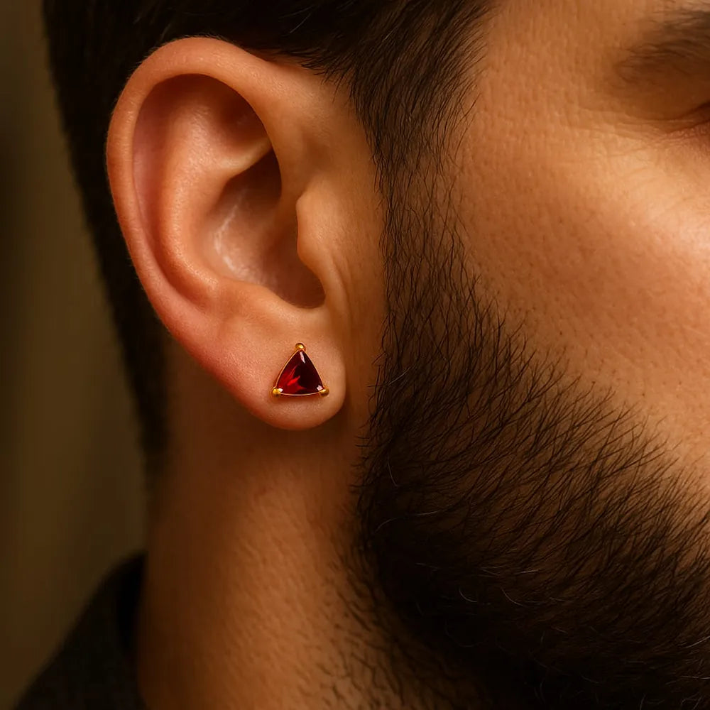 Men’s red crystal triangle ear studs with real gold plating, handcrafted on a copper and brass base for a premium masculine look. These pushback studs feature a glossy ruby-red crystal that adds confidence and edge to daily wear. Lightweight, comfortable, and perfect for men who love minimal yet powerful jewellery. From ZHome – Real, Good-Looking Jewellery.