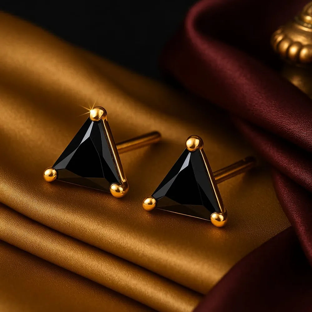 Unisex black crystal triangle ear studs with real gold plating, handcrafted with precision for a premium look. Elegant and lightweight, these daily wear earrings are made from copper and brass base with a pushback design. Ideal for men and women, these gold-plated black studs feature a glossy triangle crystal that adds a bold yet classy touch to any outfit. Perfect for gifting or personal use, from ZHome – Real, Good-Looking Jewellery.