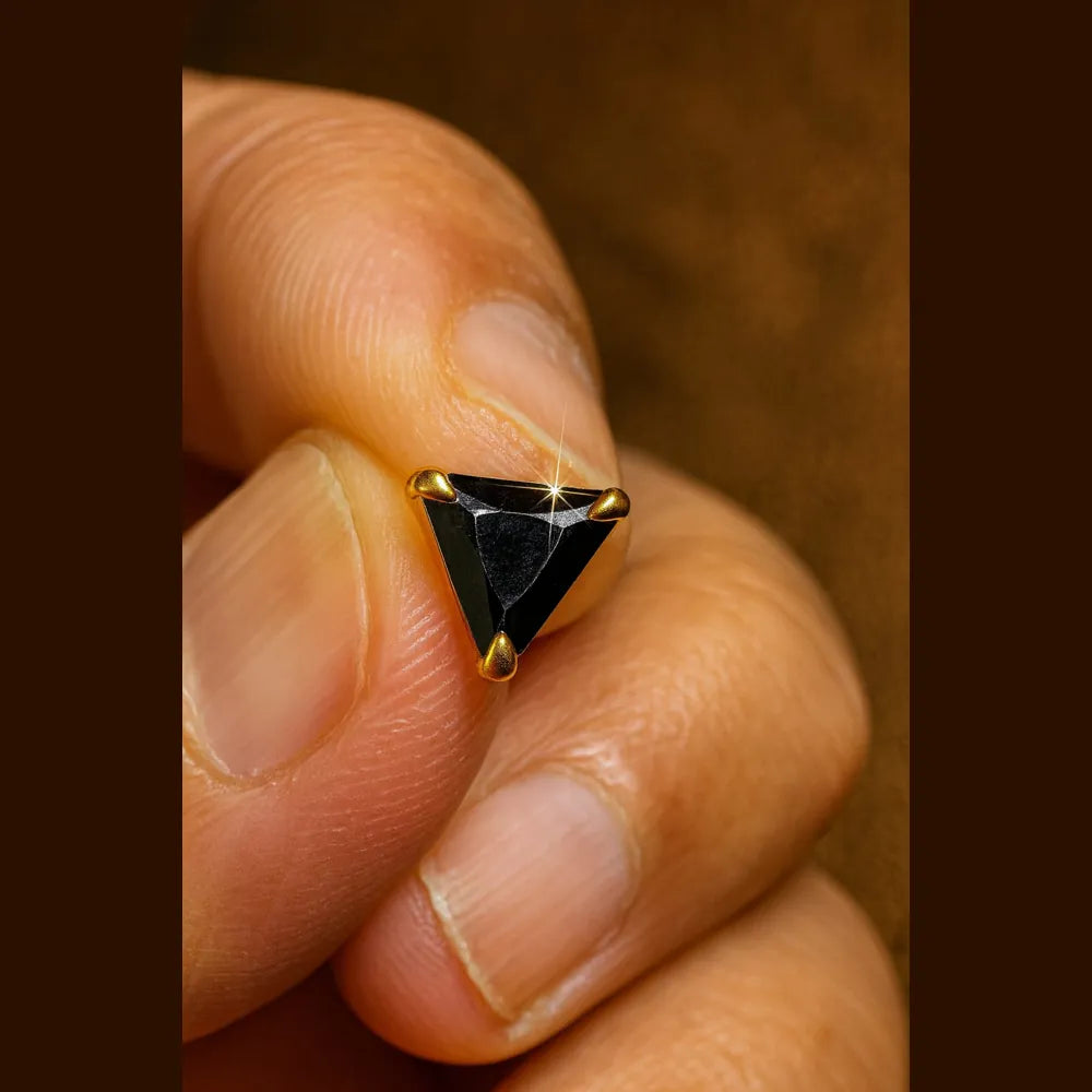 Unisex black crystal triangle ear studs with real gold plating, handcrafted with precision for a premium look. Elegant and lightweight, these daily wear earrings are made from copper and brass base with a pushback design. Ideal for men and women, these gold-plated black studs feature a glossy triangle crystal that adds a bold yet classy touch to any outfit. Perfect for gifting or personal use, from ZHome – Real, Good-Looking Jewellery.