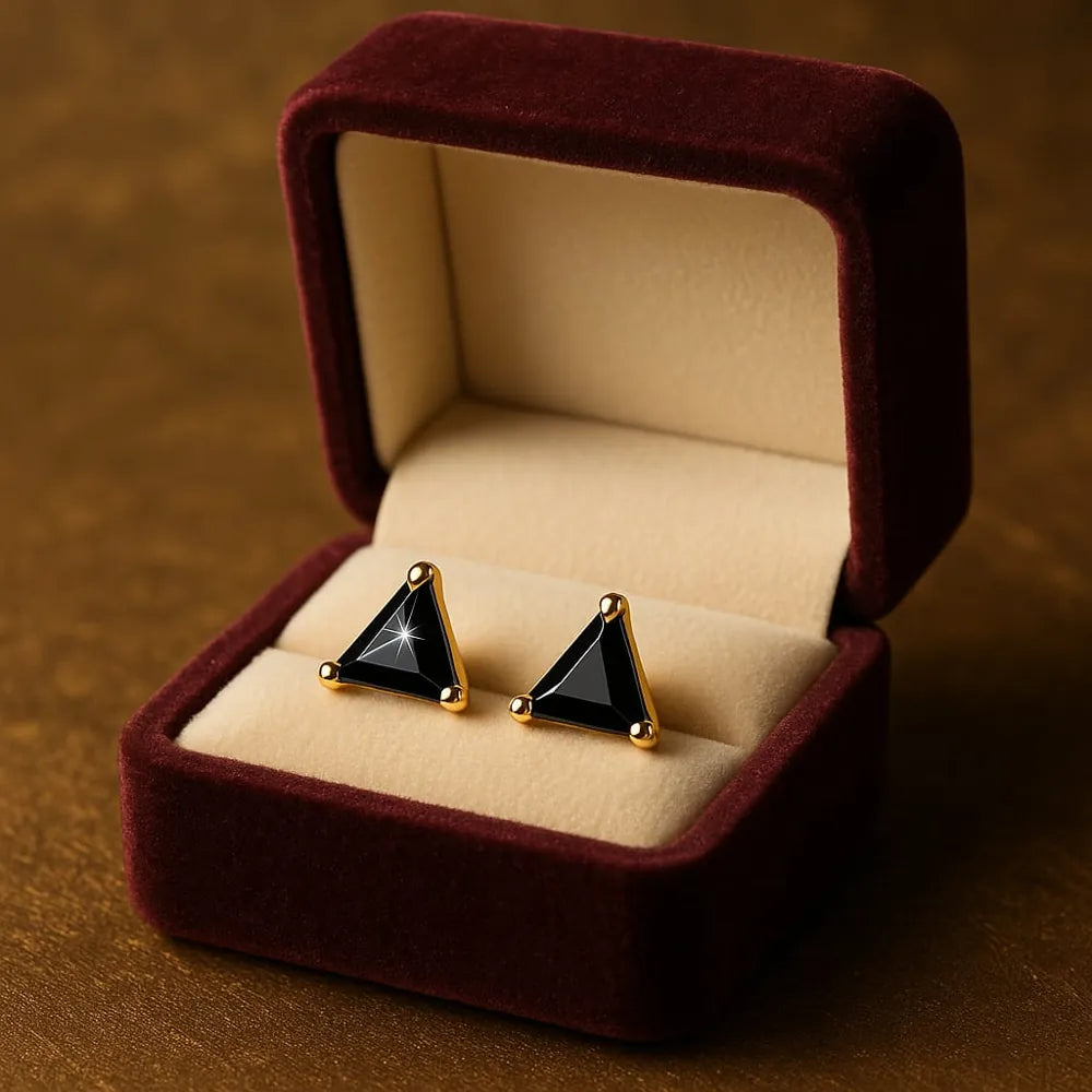 Unisex black crystal triangle ear studs with real gold plating, handcrafted with precision for a premium look. Elegant and lightweight, these daily wear earrings are made from copper and brass base with a pushback design. Ideal for men and women, these gold-plated black studs feature a glossy triangle crystal that adds a bold yet classy touch to any outfit. Perfect for gifting or personal use, from ZHome – Real, Good-Looking Jewellery.