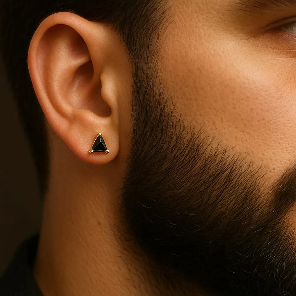 Unisex black crystal triangle ear studs with real gold plating, handcrafted with precision for a premium look. Elegant and lightweight, these daily wear earrings are made from copper and brass base with a pushback design. Ideal for men and women, these gold-plated black studs feature a glossy triangle crystal that adds a bold yet classy touch to any outfit. Perfect for gifting or personal use, from ZHome – Real, Good-Looking Jewellery.