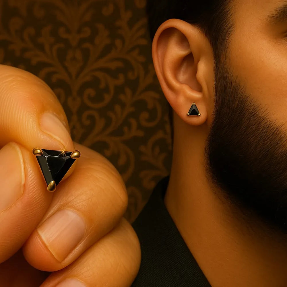 Unisex black crystal triangle ear studs with real gold plating, handcrafted with precision for a premium look. Elegant and lightweight, these daily wear earrings are made from copper and brass base with a pushback design. Ideal for men and women, these gold-plated black studs feature a glossy triangle crystal that adds a bold yet classy touch to any outfit. Perfect for gifting or personal use, from ZHome – Real, Good-Looking Jewellery.