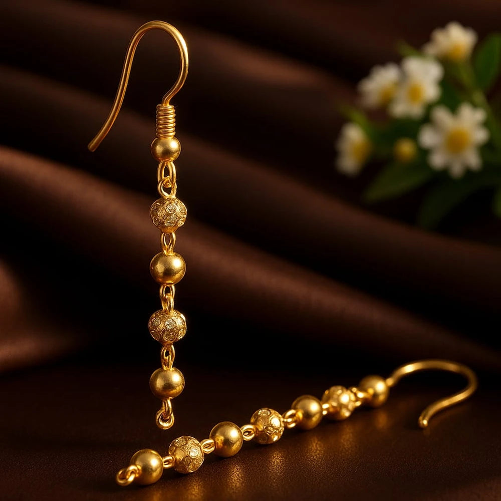 Zhome gold-plated handmade Sui-Dhaga earrings displayed on brown fabric – design by Sandeep Singh