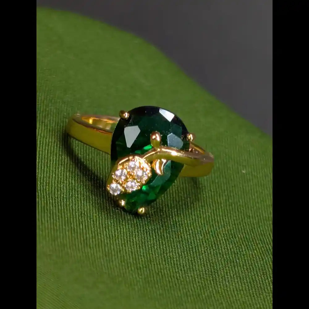 Adjustable gold-plated ring with green stone front view